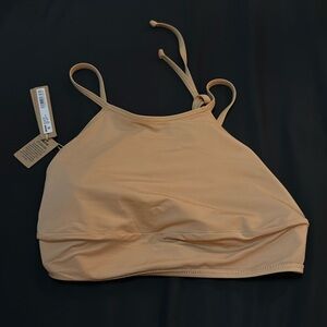 Skims high neck swim top